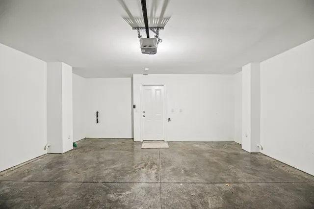 a view of a room with a sink and chandelier fan