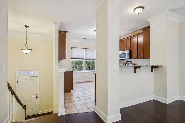 a view of a livingroom with furniture and hardwood floor