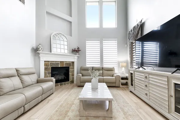a living room with furniture fireplace and window