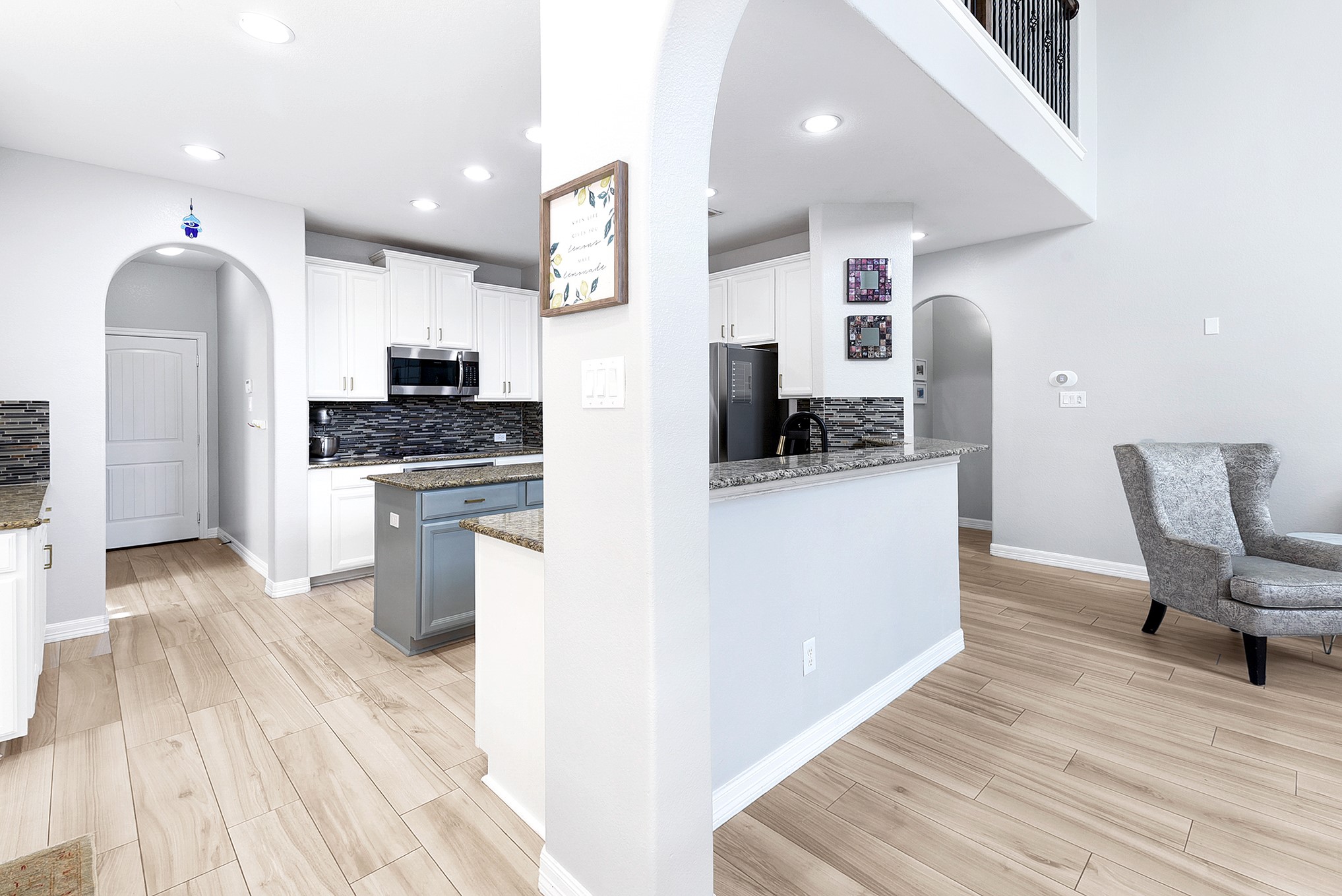 29022 Pinnacle Ridge Drive Katy, TX 77494 - Photo 15 of 45 a kitchen with stainless steel appliances a stove top oven a sink dishwasher and a refrigerator