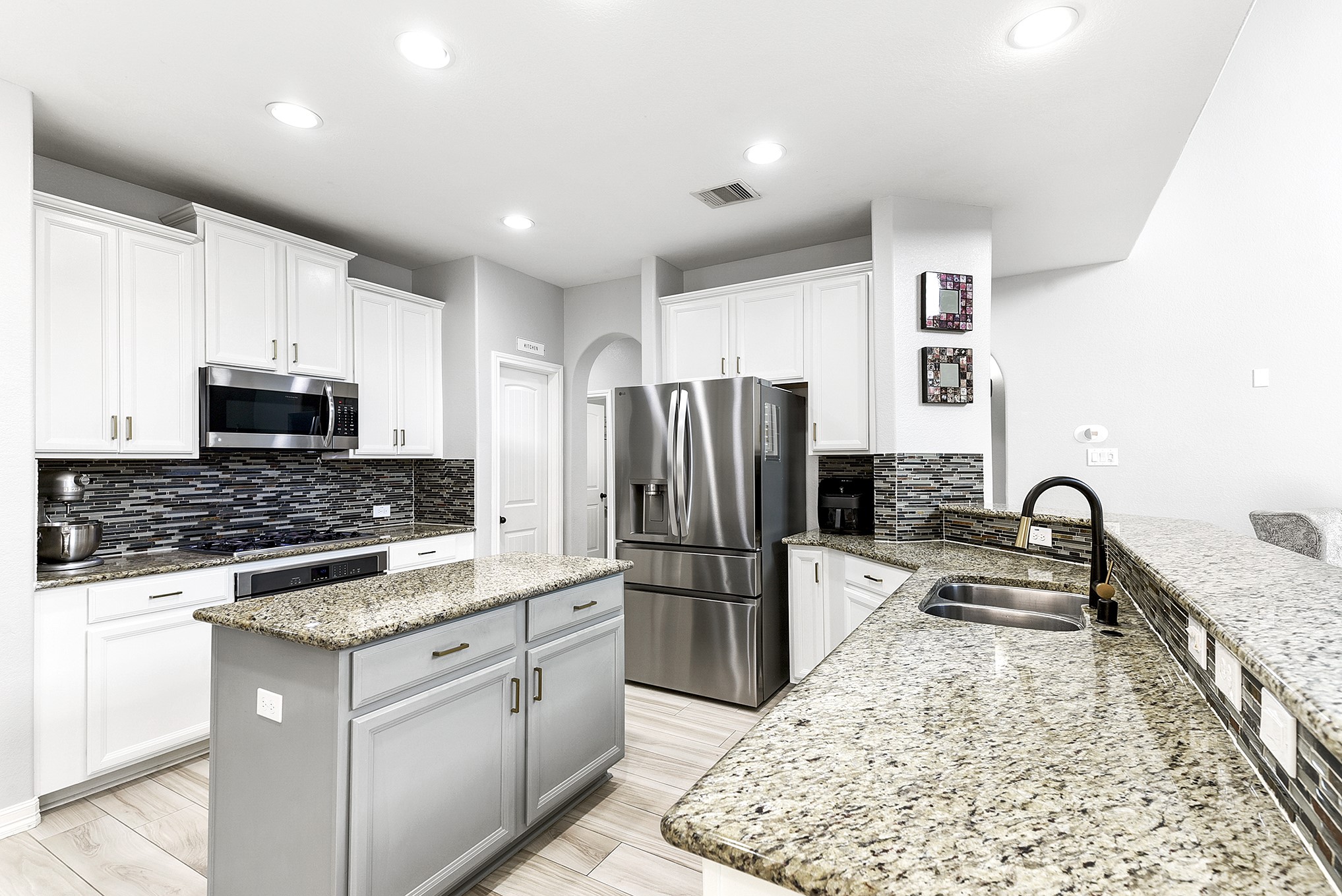 29022 Pinnacle Ridge Drive Katy, TX 77494 - Photo 17 of 45 a kitchen with refrigerator and furniture