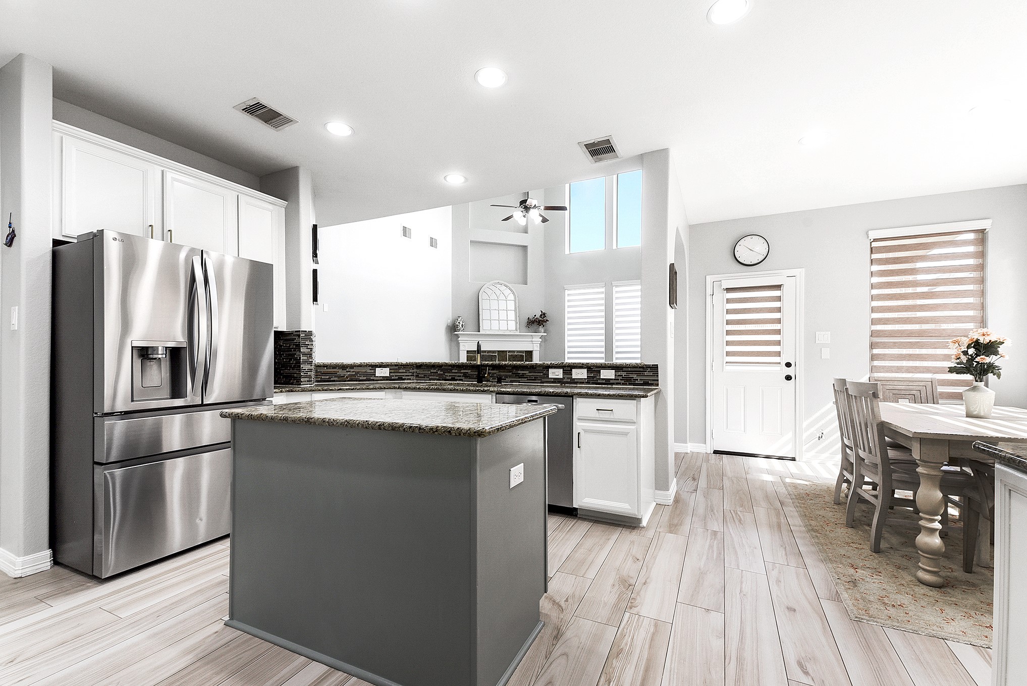 29022 Pinnacle Ridge Drive Katy, TX 77494 - Photo 19 of 45 a kitchen with stainless steel appliances a refrigerator a sink dishwasher a stove and white countertops with wooden floor