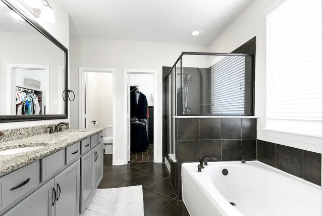 a bathroom with a bathtub and a sink