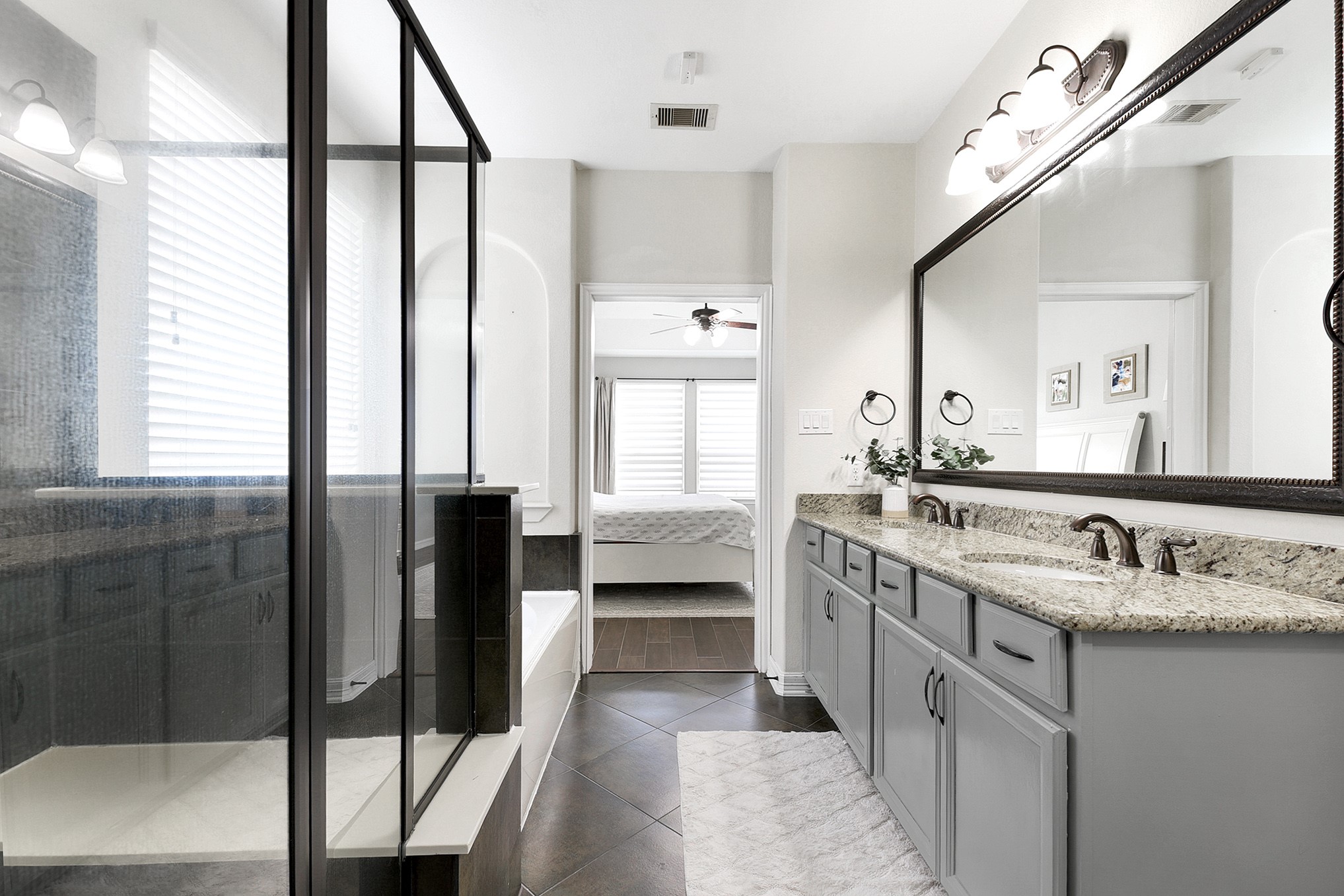 29022 Pinnacle Ridge Drive Katy, TX 77494 - Photo 28 of 45 a bathroom with a double vanity sink and mirror