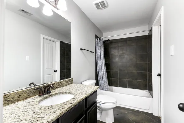 a view of a livingroom with furniture and staircase