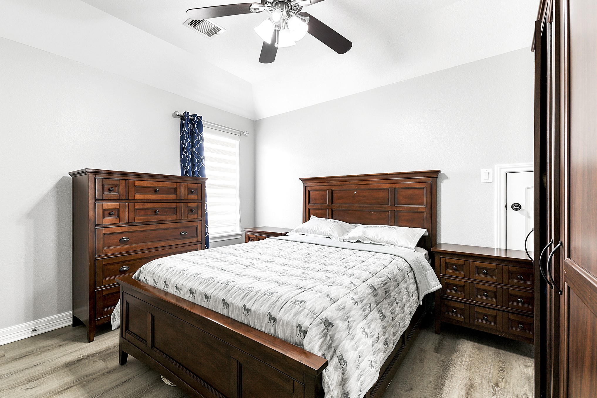 29022 Pinnacle Ridge Drive Katy, TX 77494 - Photo 35 of 45 a bedroom with a bed and wooden floor