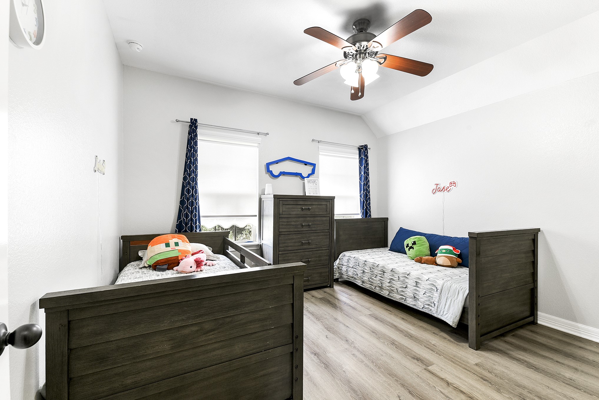 29022 Pinnacle Ridge Drive Katy, TX 77494 - Photo 37 of 45 a bedroom with a bed and a chandelier