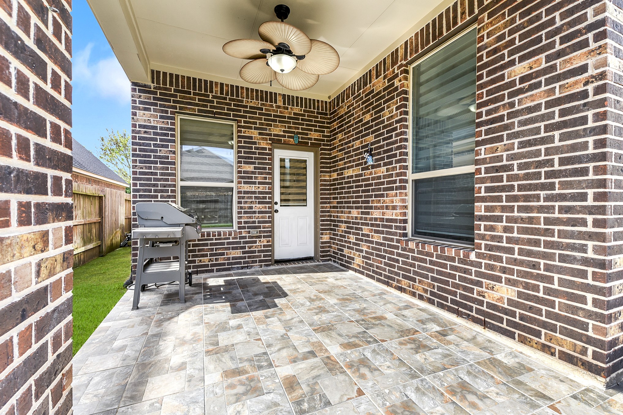 29022 Pinnacle Ridge Drive Katy, TX 77494 - Photo 40 of 45 a view of a patio with a table and chairs and potted plants