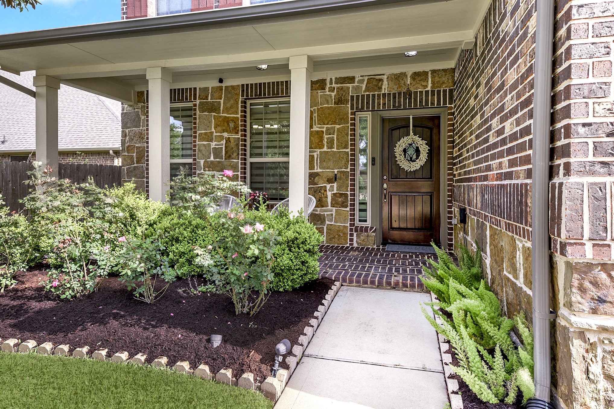 29022 Pinnacle Ridge Drive Katy, TX 77494 - Photo 5 of 45 a front view of a house with a yard