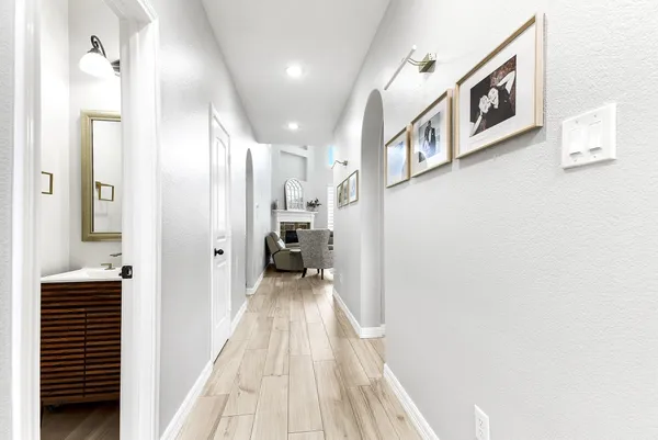 a view of a hallway with a white walls