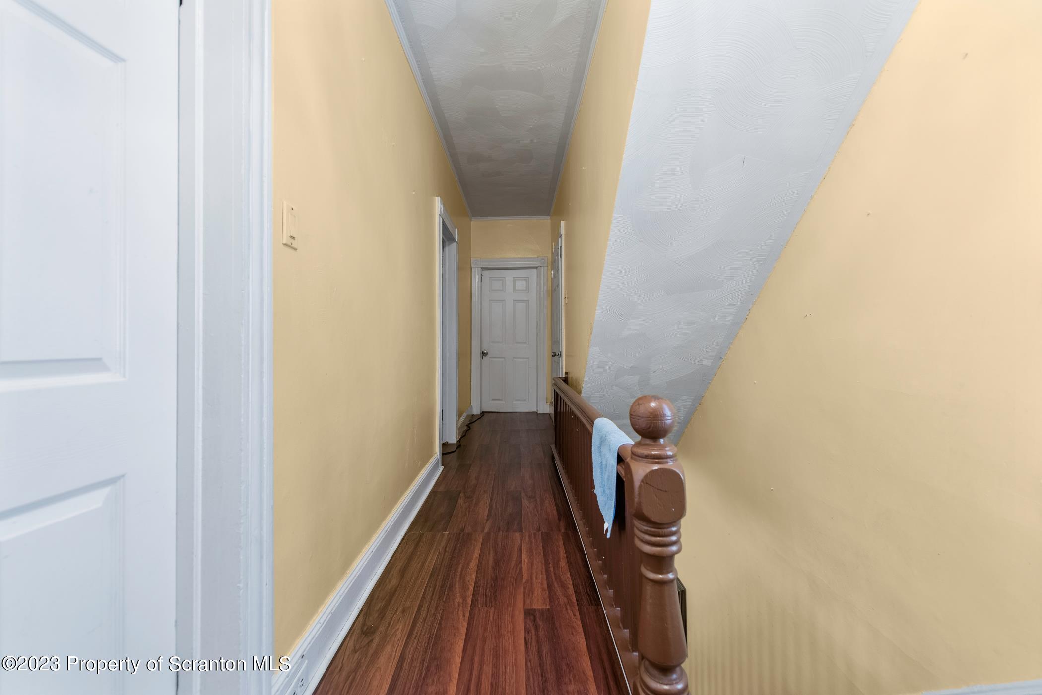 726 Hickory Street Scranton, PA 18505 - Photo 14 of 26 a view of a hallway with wooden floor
