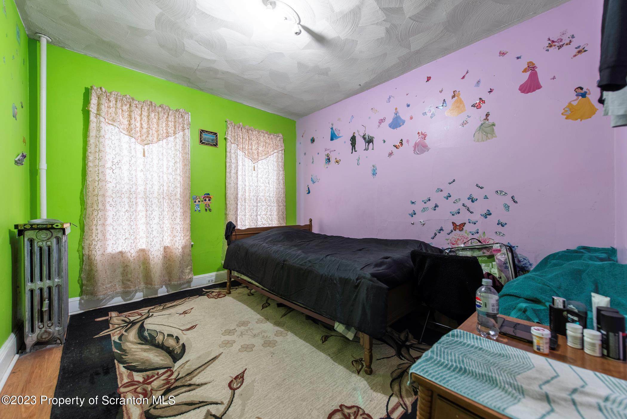 726 Hickory Street Scranton, PA 18505 - Photo 16 of 26 a bedroom with a bed and a window