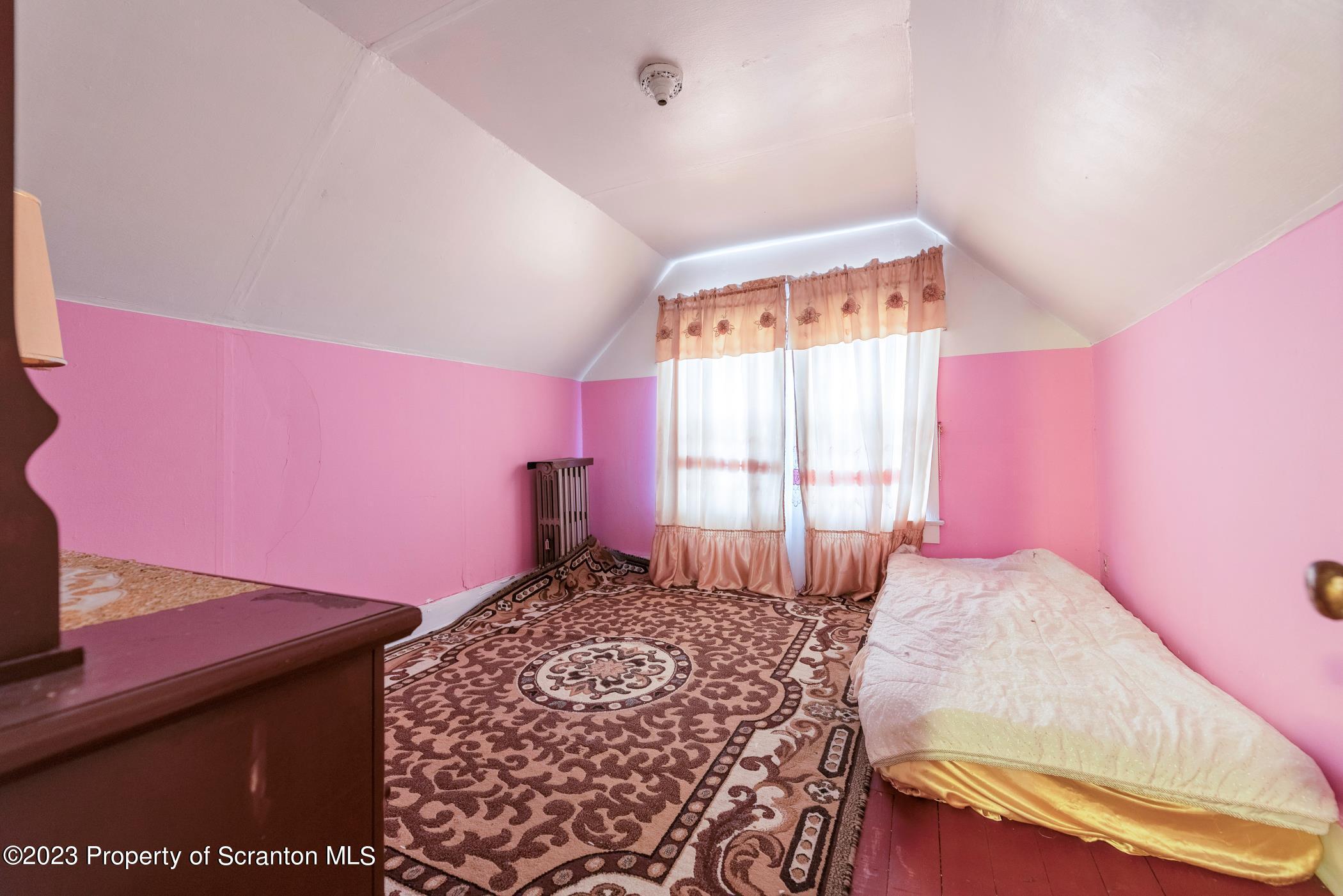 726 Hickory Street Scranton, PA 18505 - Photo 20 of 26 a bedroom with a bed and a window