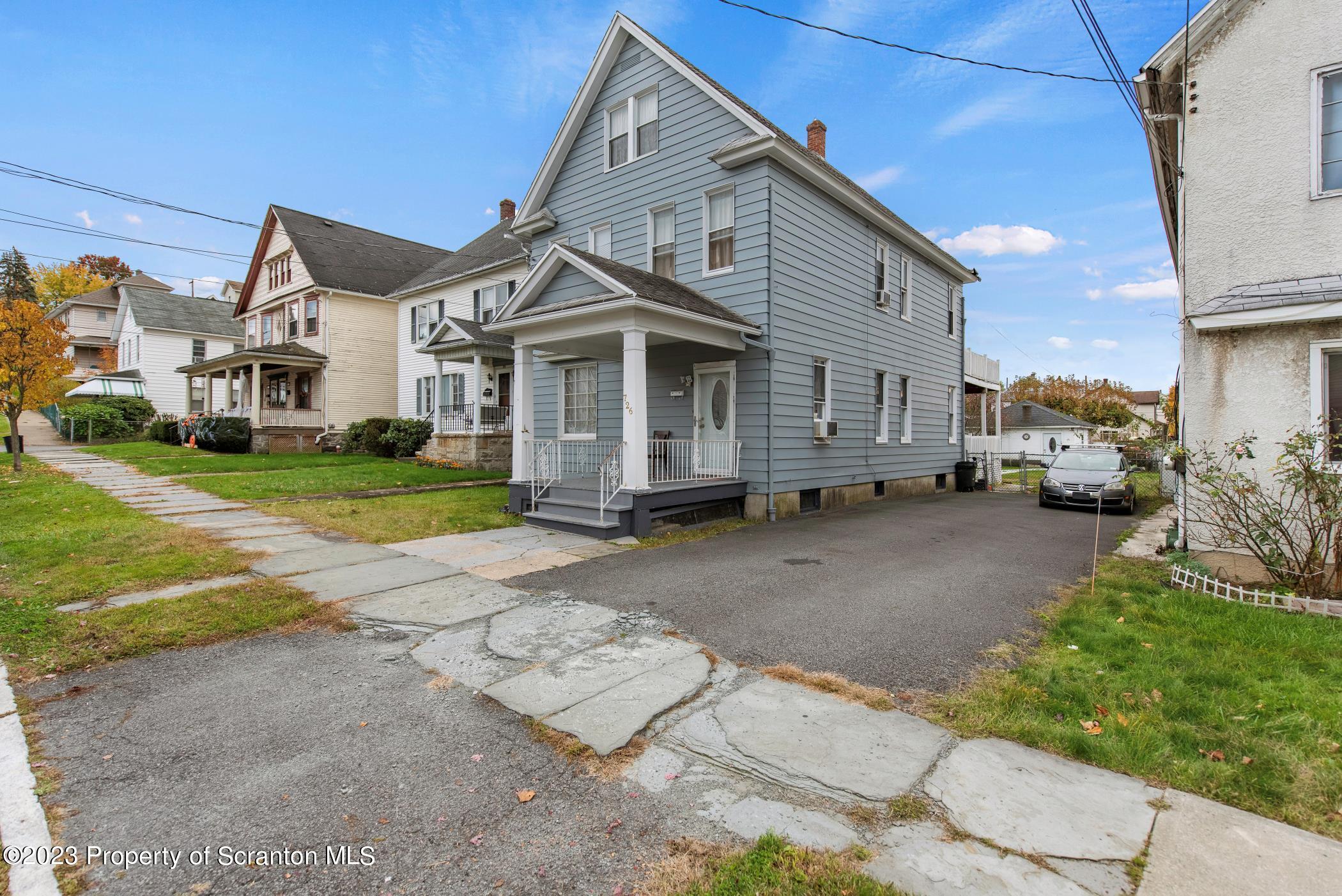 726 Hickory Street Scranton, PA 18505 - Photo 2 of 26 a front view of a house with a yard