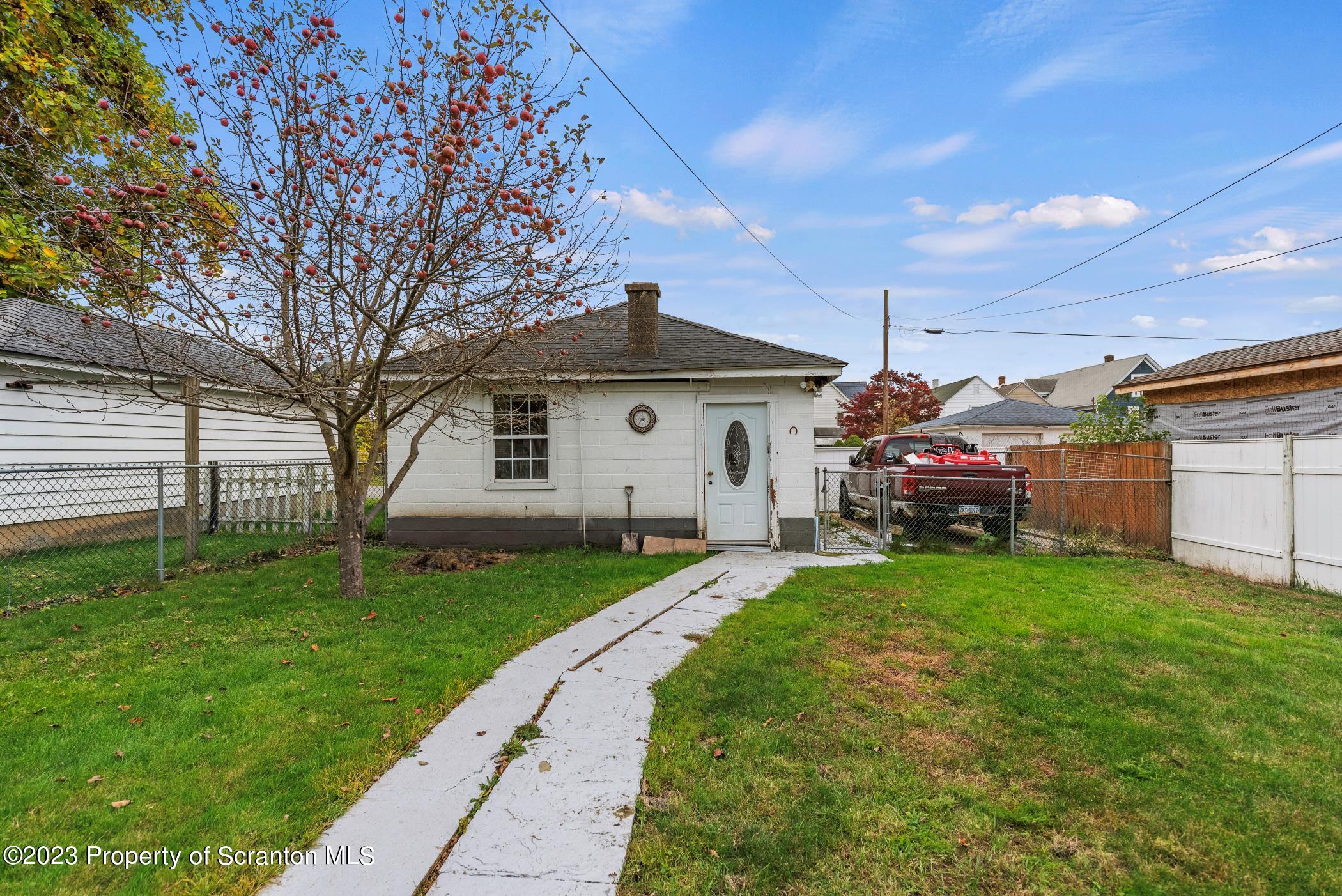 726 Hickory Street Scranton, PA 18505 - Photo 22 of 26 a front view of a house with a yard