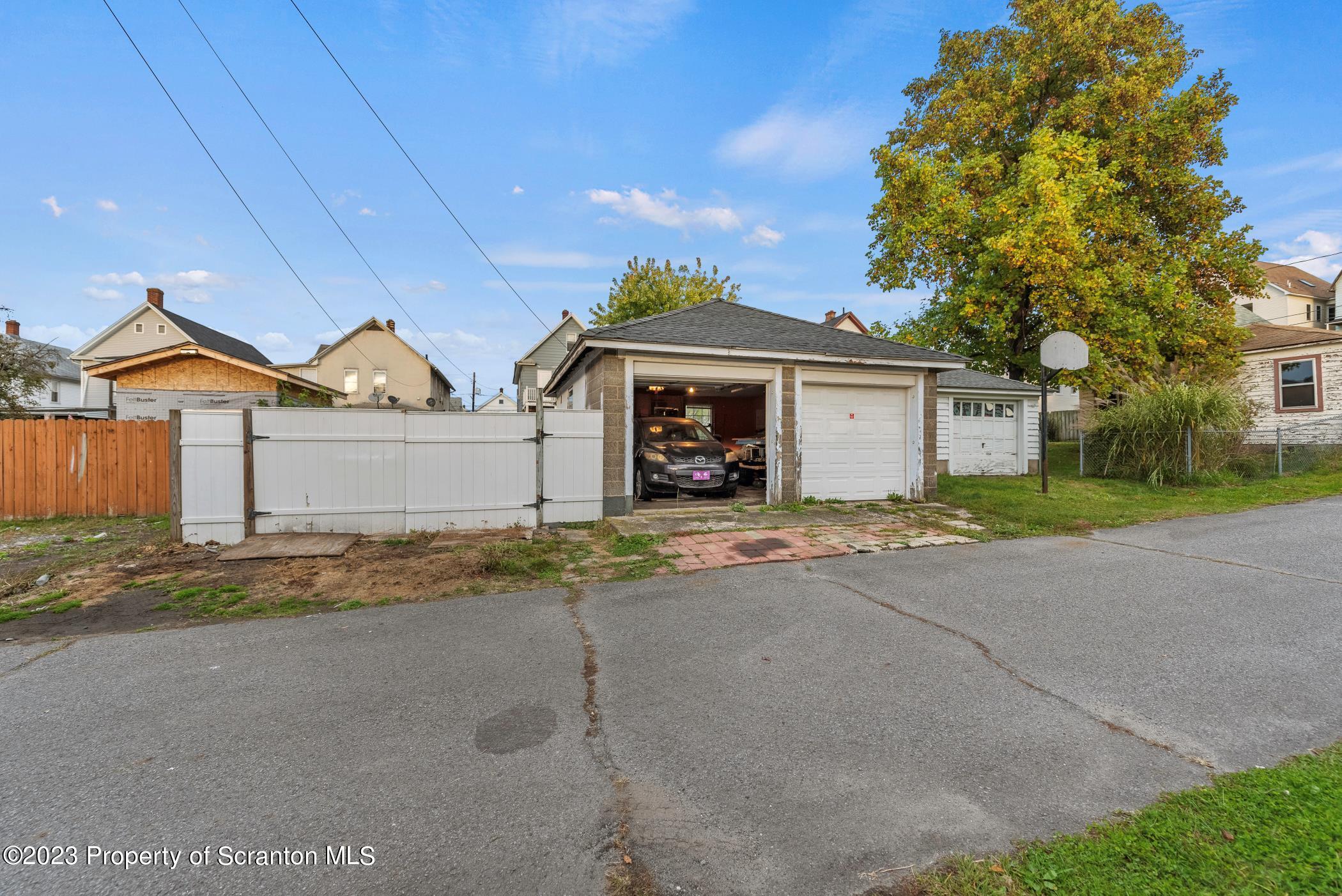 726 Hickory Street Scranton, PA 18505 - Photo 23 of 26 a front view of a house with a yard and garage