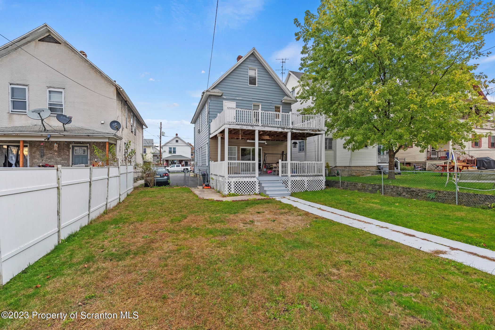 726 Hickory Street Scranton, PA 18505 - Photo 3 of 26 a front view of a house with a yard