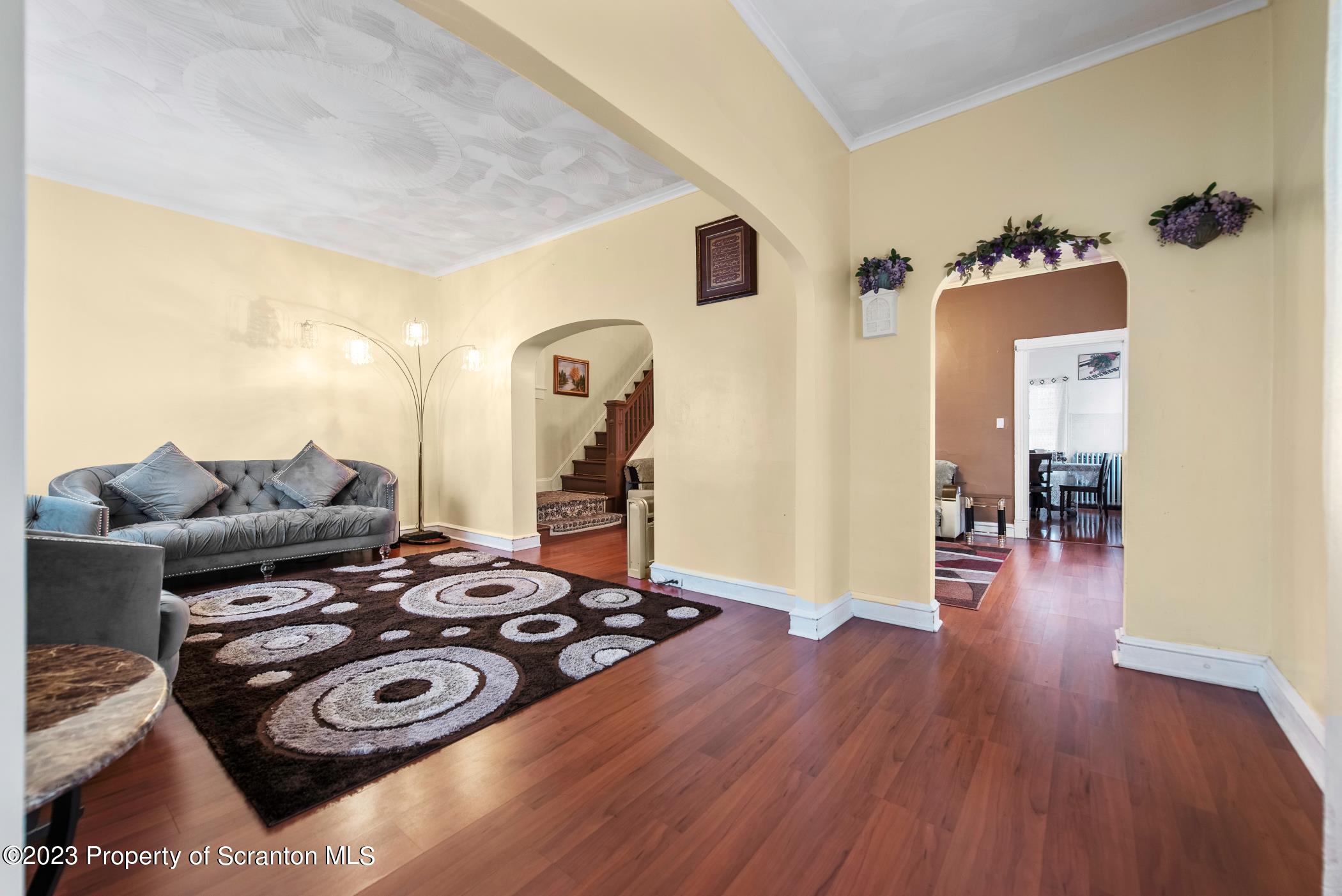 726 Hickory Street Scranton, PA 18505 - Photo 4 of 26 a living room with furniture and a wooden floor