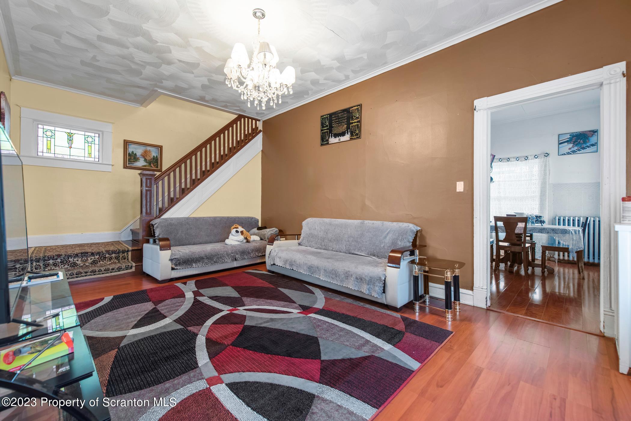 726 Hickory Street Scranton, PA 18505 - Photo 6 of 26 a living room with furniture and a wooden floor
