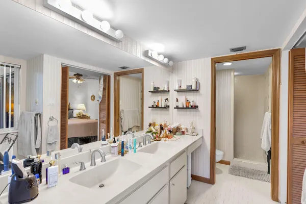 a bathroom with a sink double vanity and a mirror
