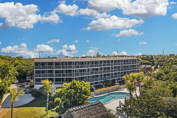 a view of a street with cars