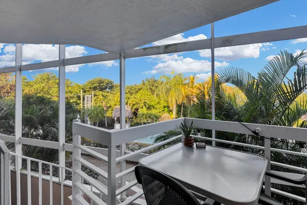 a view of kitchen with furniture and floor to ceiling window