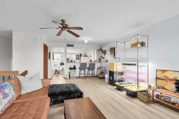 a bedroom with furniture and a chandelier