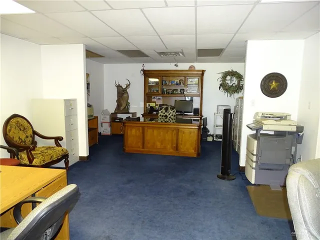 a living room with furniture and flat screen tv