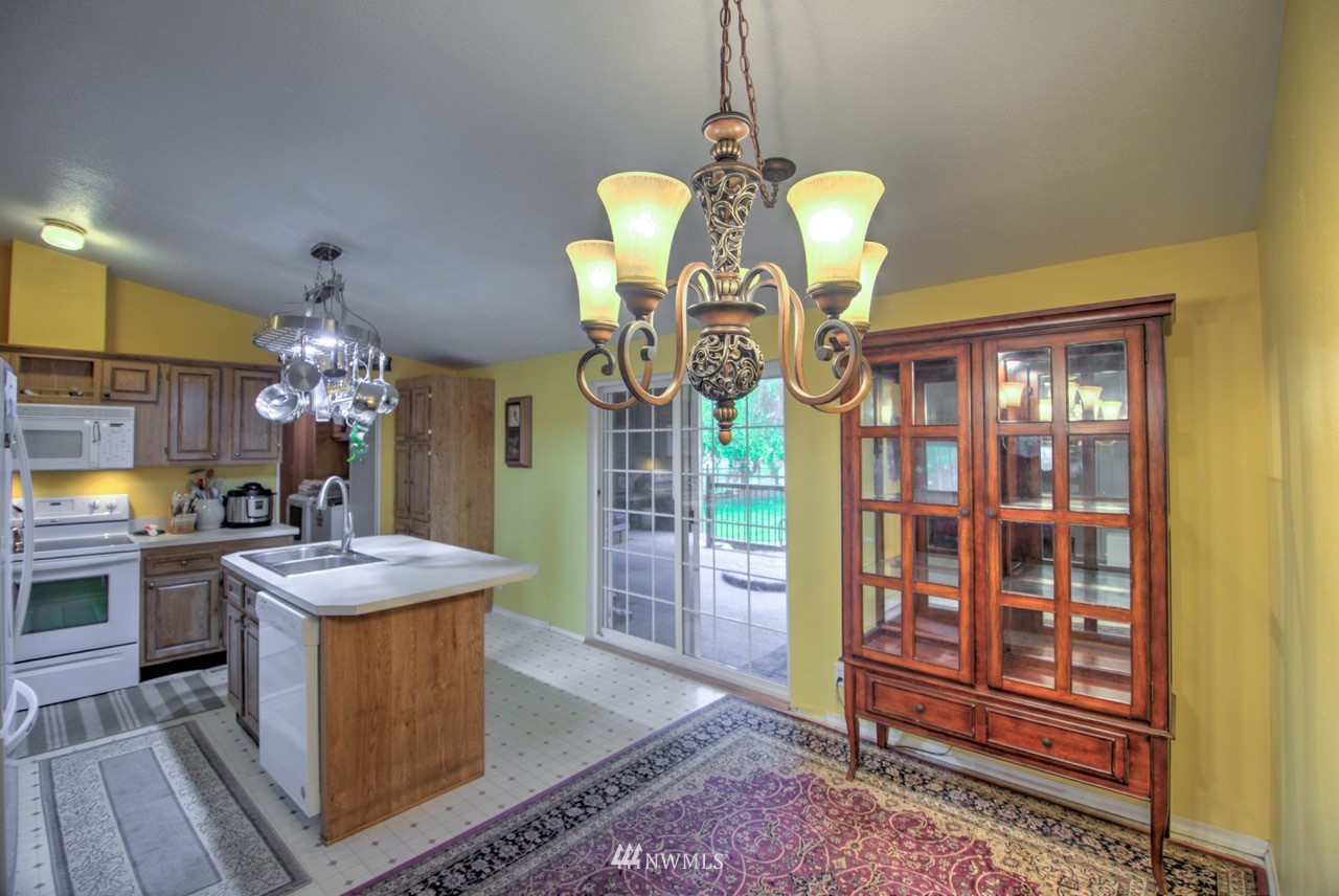 18101 Canaday Lane Southwest Rochester, WA 98579 - Photo 4 of 32 a dining room with chandelier