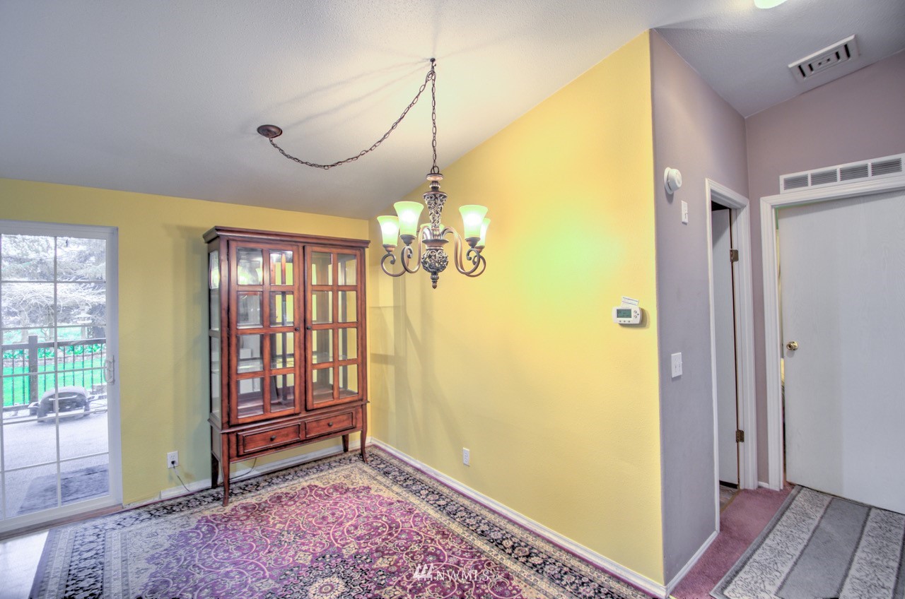 18101 Canaday Lane Southwest Rochester, WA 98579 - Photo 5 of 32 a view of a room with window and wooden floor