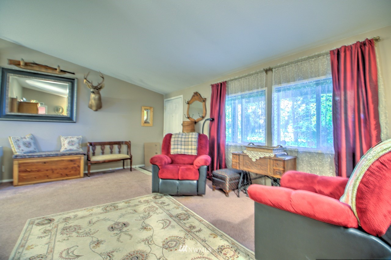 18101 Canaday Lane Southwest Rochester, WA 98579 - Photo 7 of 32 a bedroom with furniture and a large window