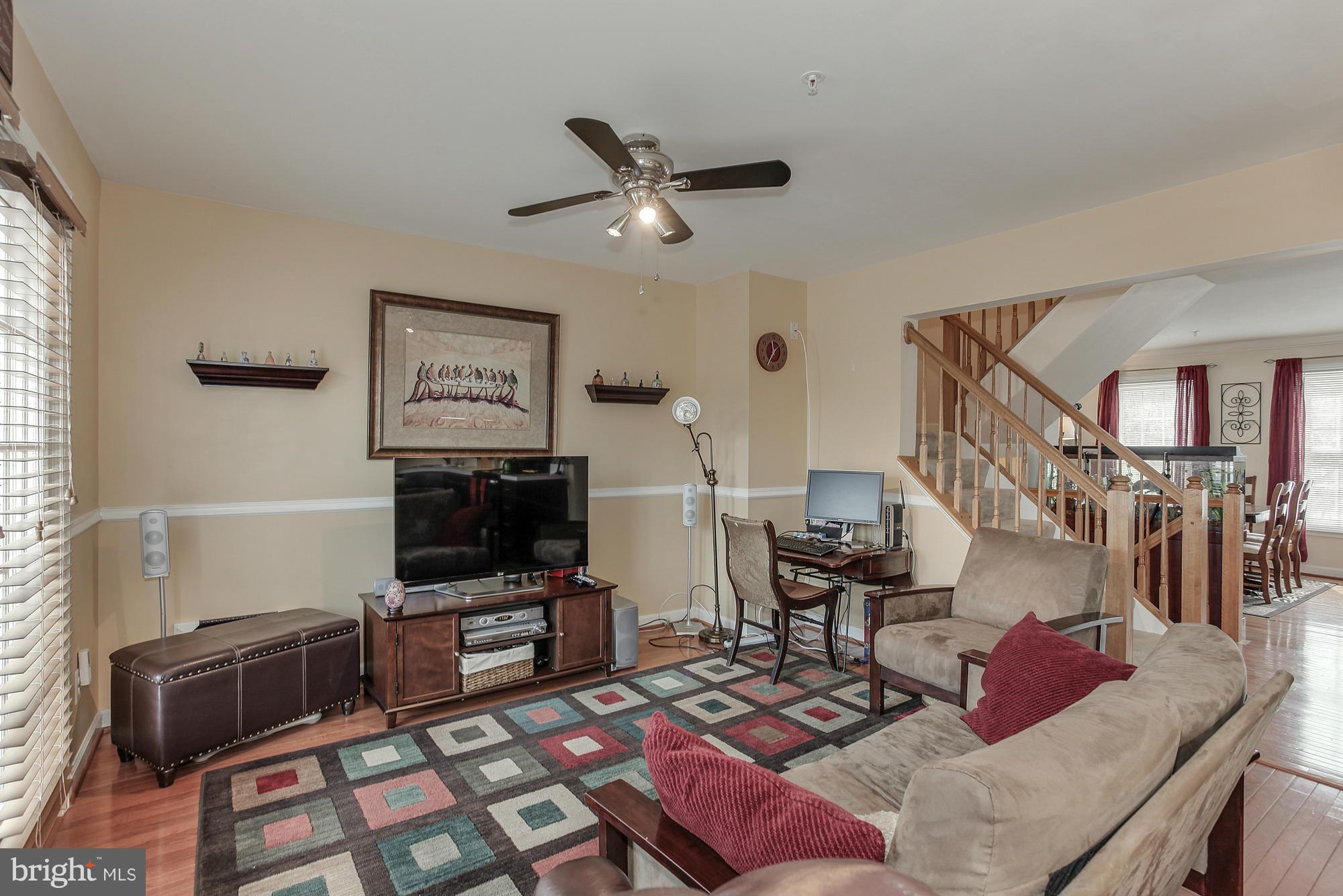 3504 Hammerstone Road Laurel, MD 20724 - Photo 12 of 30 a living room with furniture and a flat screen tv