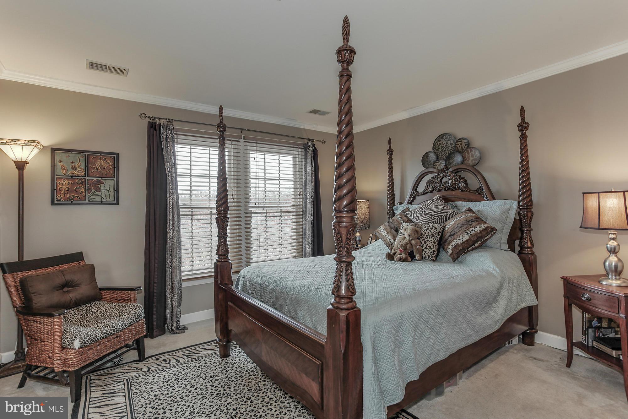 3504 Hammerstone Road Laurel, MD 20724 - Photo 15 of 30 a bedroom with a bed and wooden floor