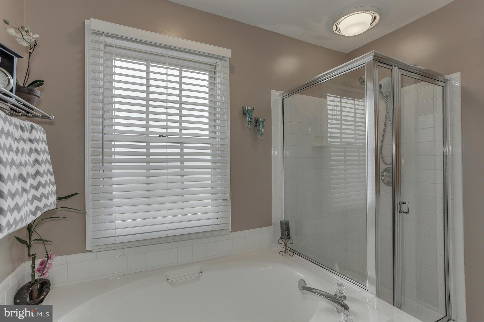 3504 Hammerstone Road Laurel, MD 20724 - Photo 17 of 30 a bathroom with a shower and a window