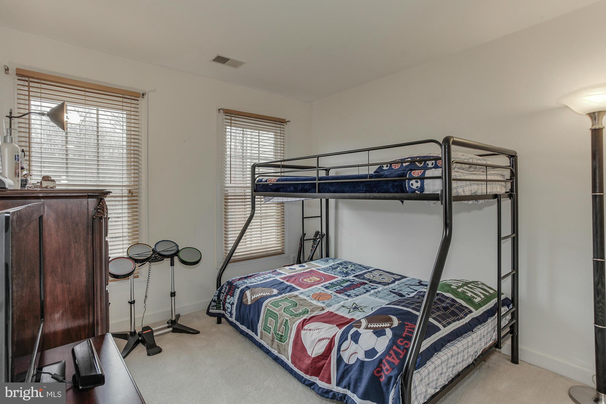 3504 Hammerstone Road Laurel, MD 20724 - Photo 19 of 30 a bedroom with a bed and wooden floor