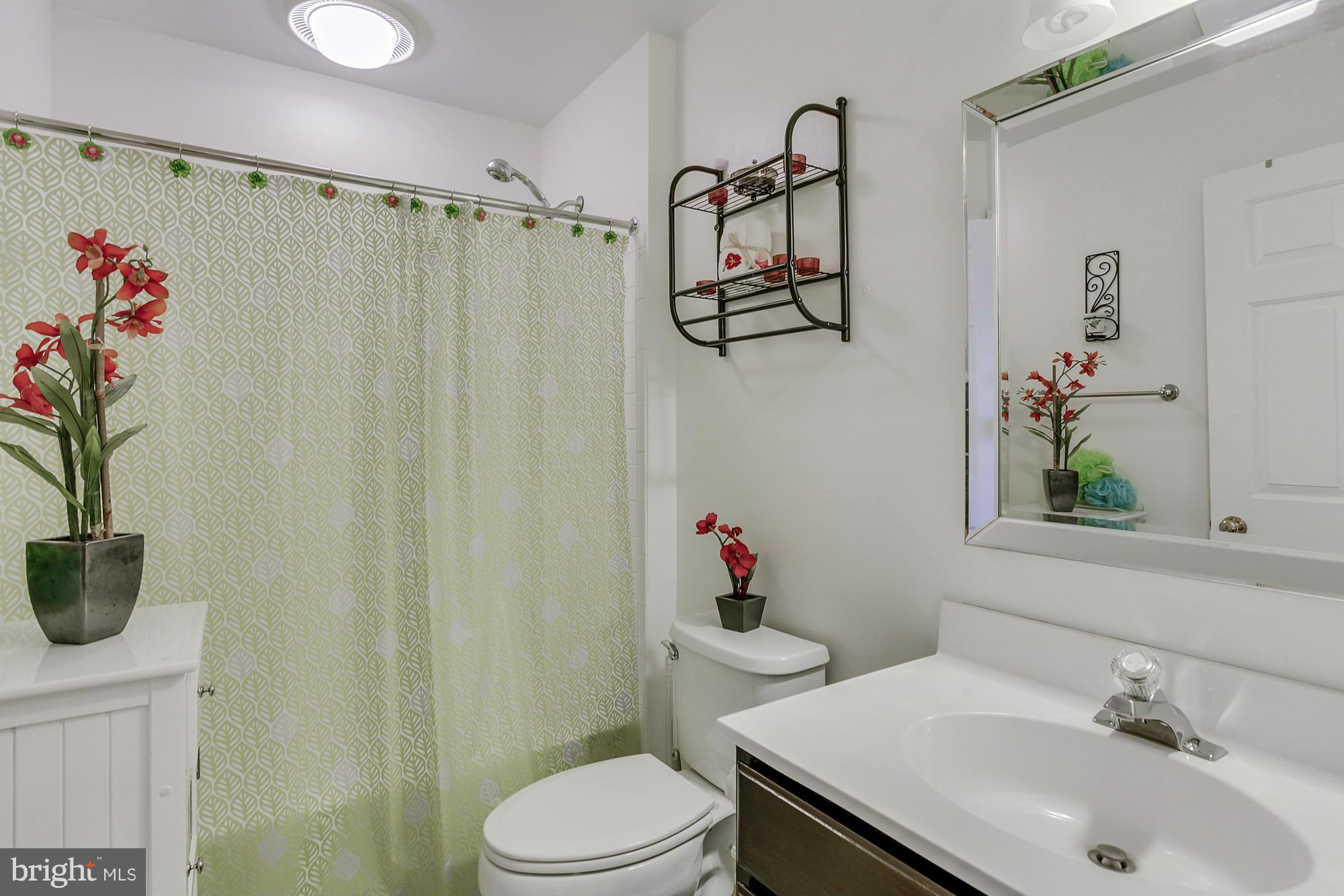 3504 Hammerstone Road Laurel, MD 20724 - Photo 20 of 30 a bathroom with a sink toilet and shower