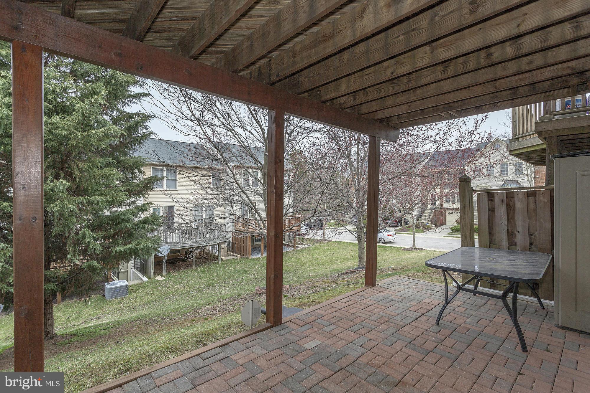 3504 Hammerstone Road Laurel, MD 20724 - Photo 22 of 30 a view of a porch with chairs and backyard