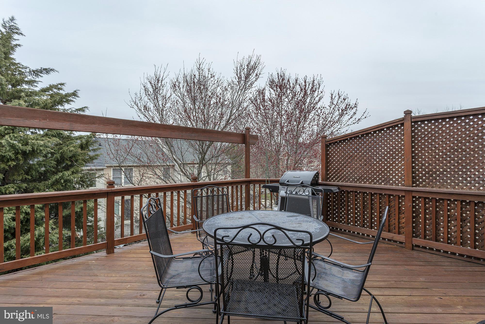 3504 Hammerstone Road Laurel, MD 20724 - Photo 23 of 30 a view of a chairs and table on the deck