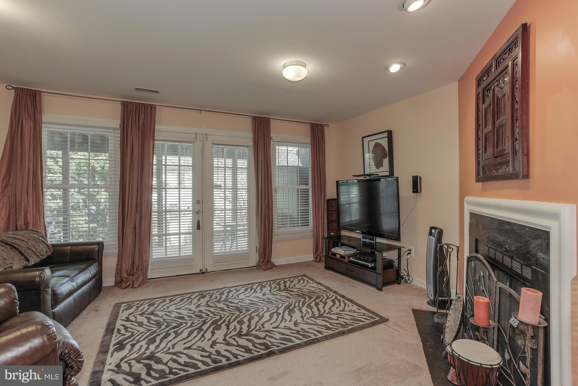3504 Hammerstone Road Laurel, MD 20724 - Photo 4 of 30 a living room with furniture and a flat screen tv