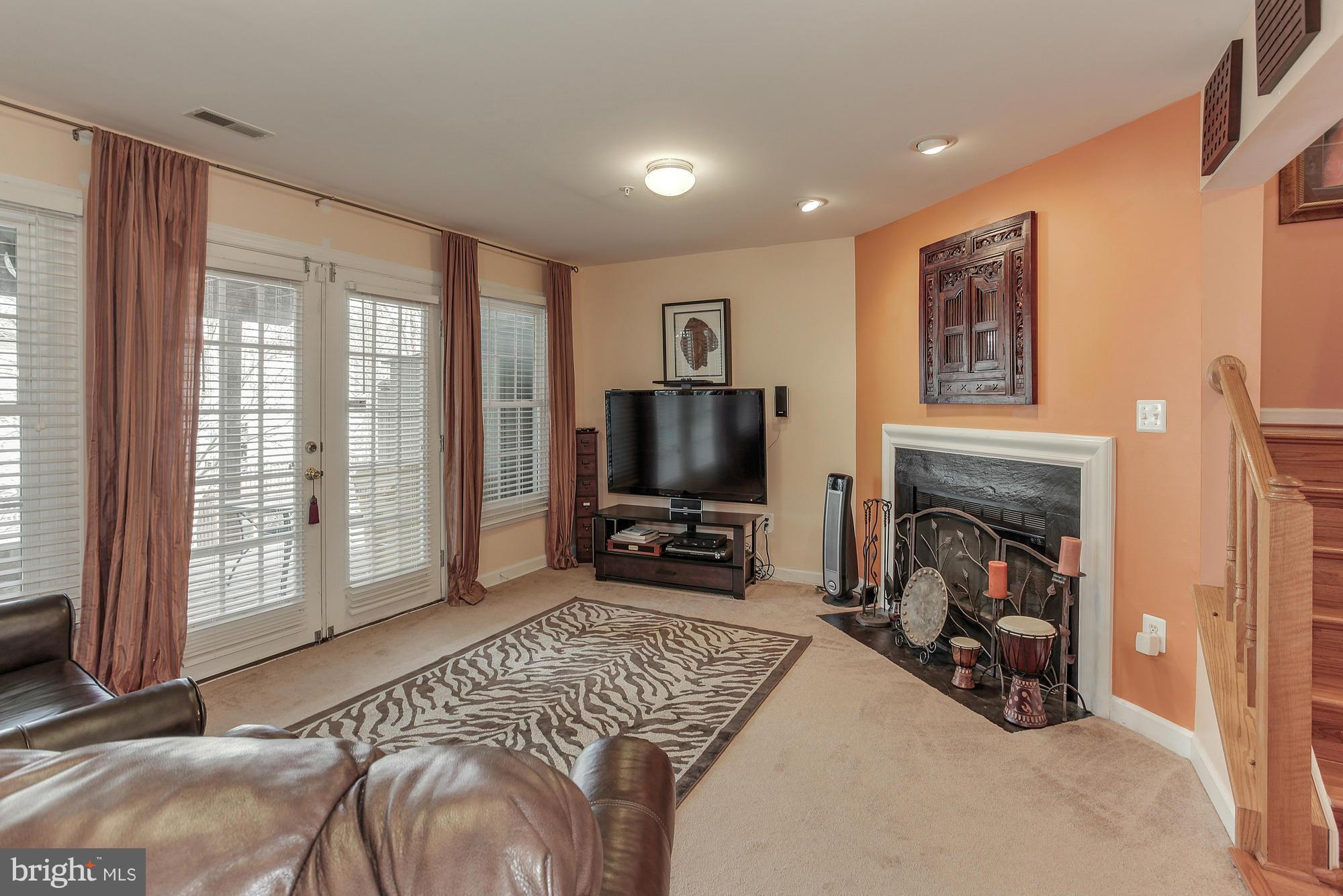 3504 Hammerstone Road Laurel, MD 20724 - Photo 5 of 30 a bedroom with furniture and a flat screen tv