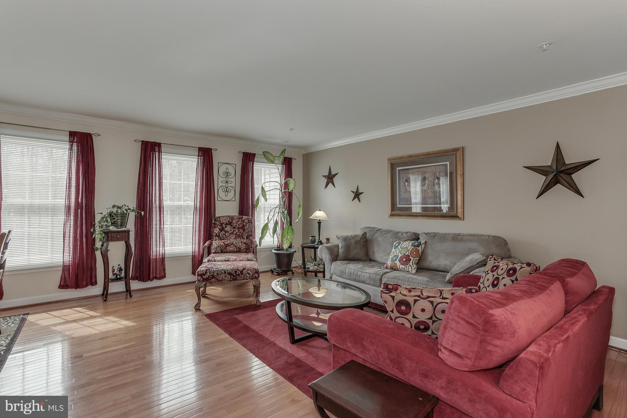 3504 Hammerstone Road Laurel, MD 20724 - Photo 9 of 30 a living room with furniture and a wooden floor