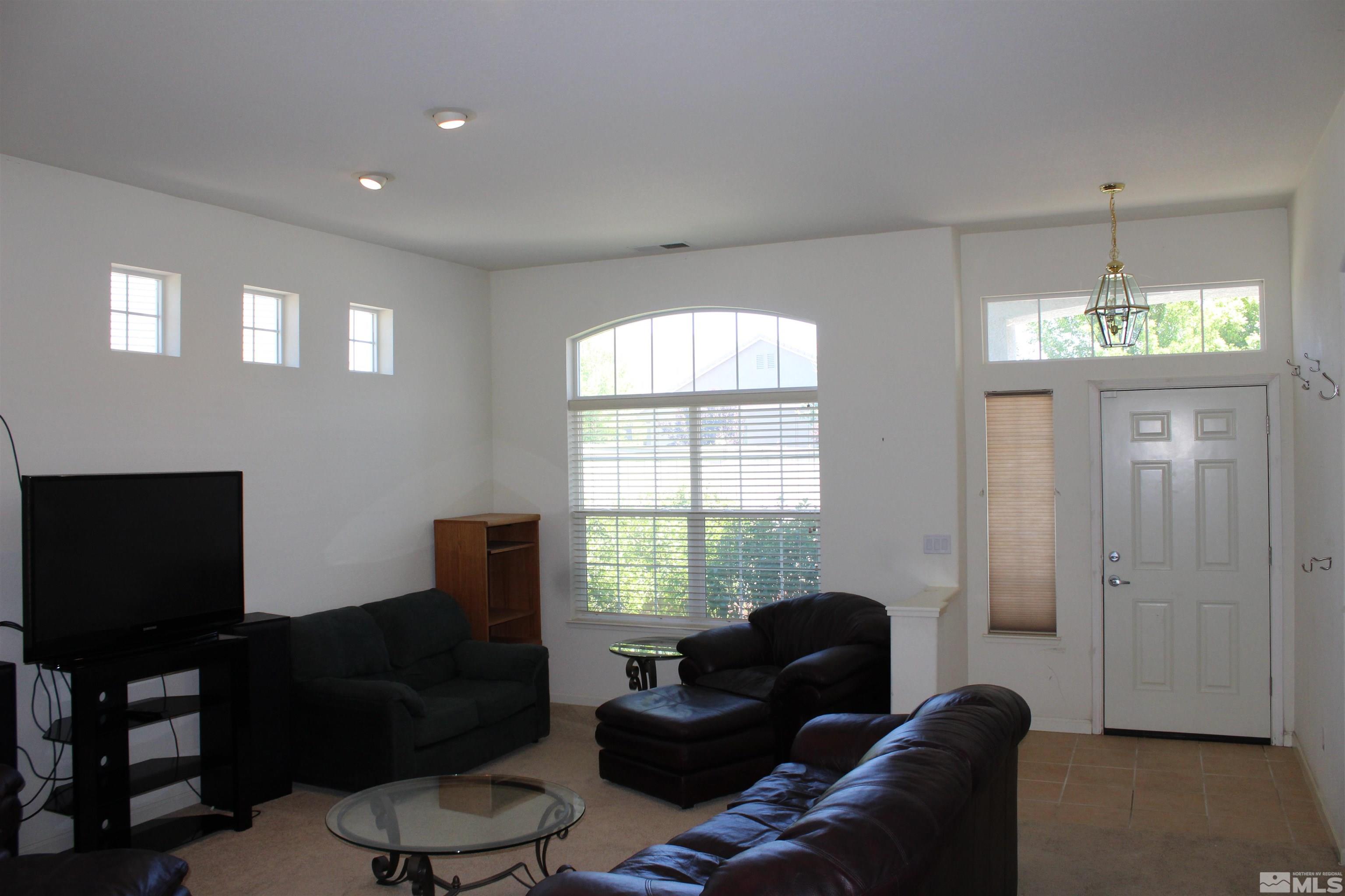 9533 Steep Climb Court Reno, NV 89521 - Photo 2 of 15 a living room with furniture and a window