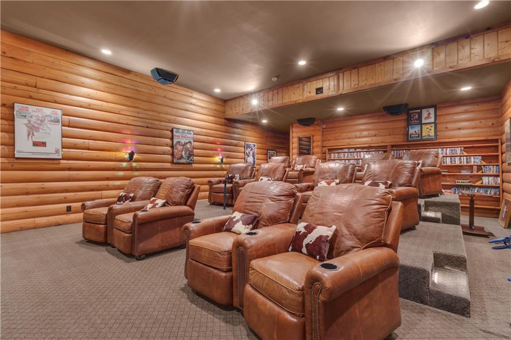 14501 Woolsey Road Hampton, GA 30228 - Photo 34 of 143 a media room with lots of chairs and a projector