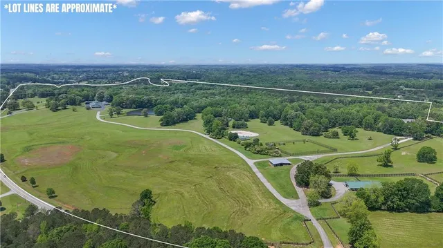 an aerial view of a house with outdoor space