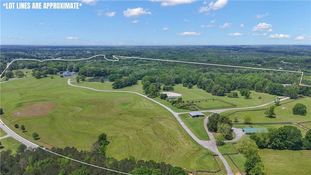 14501 Woolsey Road Hampton, GA 30228 - Photo 4 of 143 a view of a golf course with a swimming pool