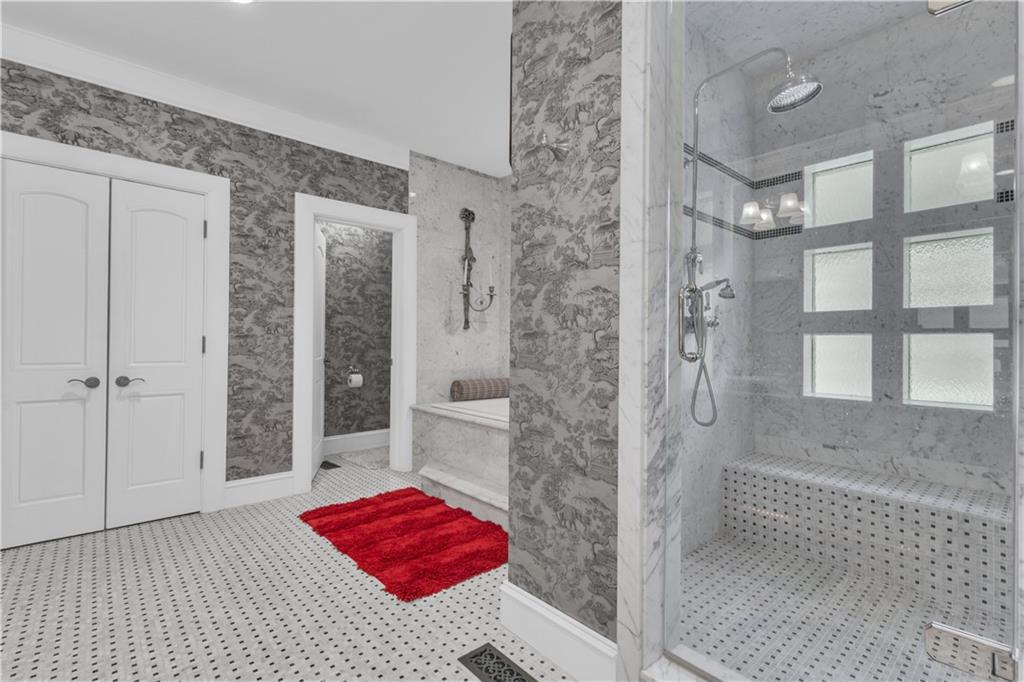 14501 Woolsey Road Hampton, GA 30228 - Photo 42 of 143 a bathroom with a tub shower and a sink