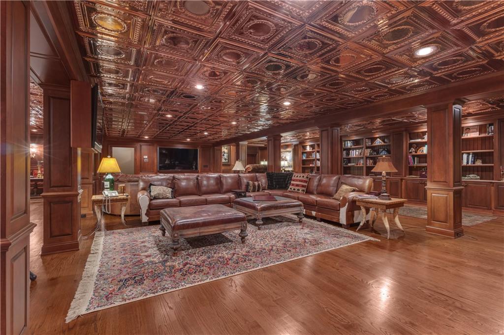 14501 Woolsey Road Hampton, GA 30228 - Photo 67 of 143 a living room with lots of furniture and a wooden floor