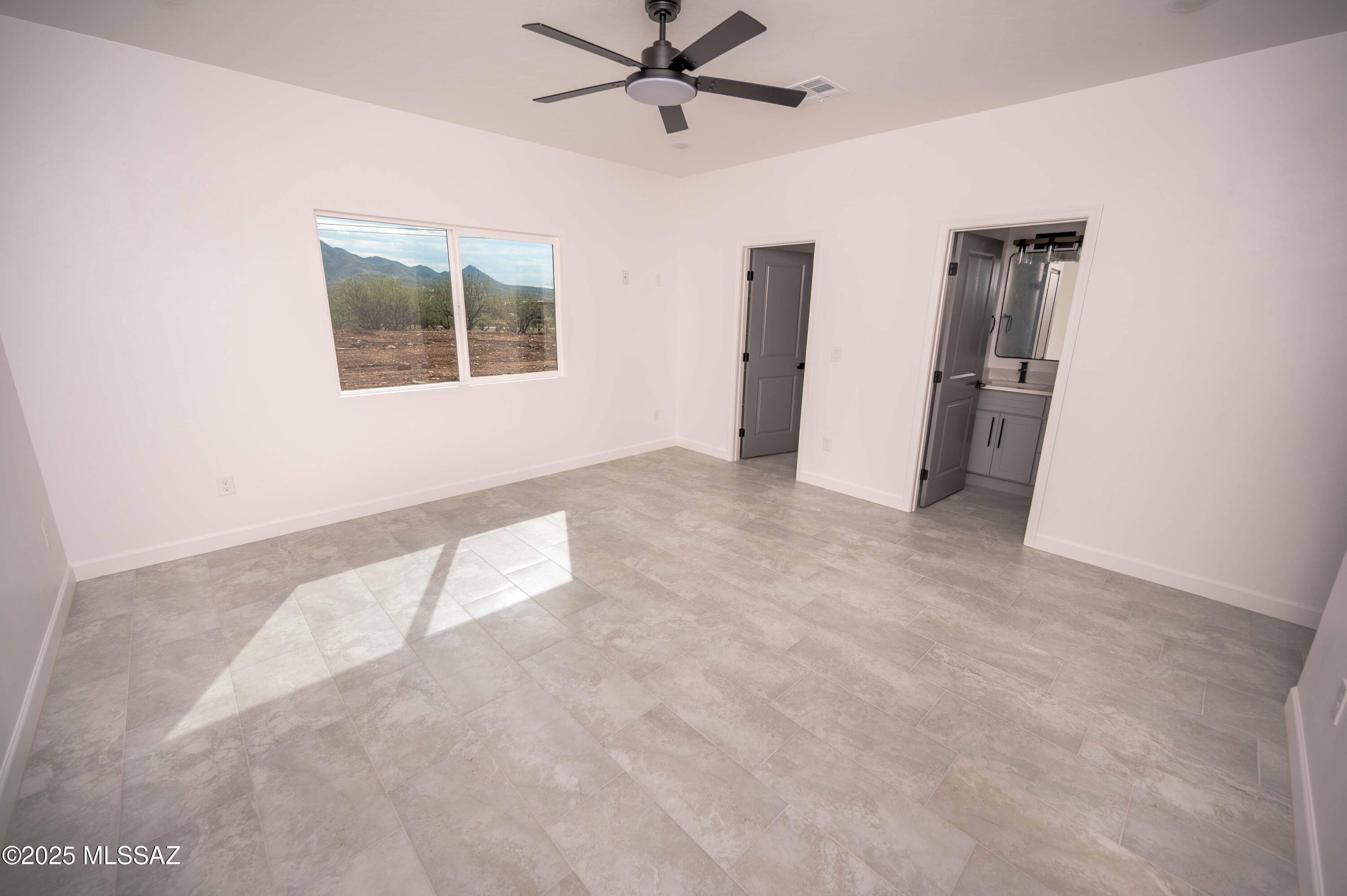 1781 Elder Court Rio Rico, AZ 85648 - Photo 16 of 50 a view of an empty room with a window