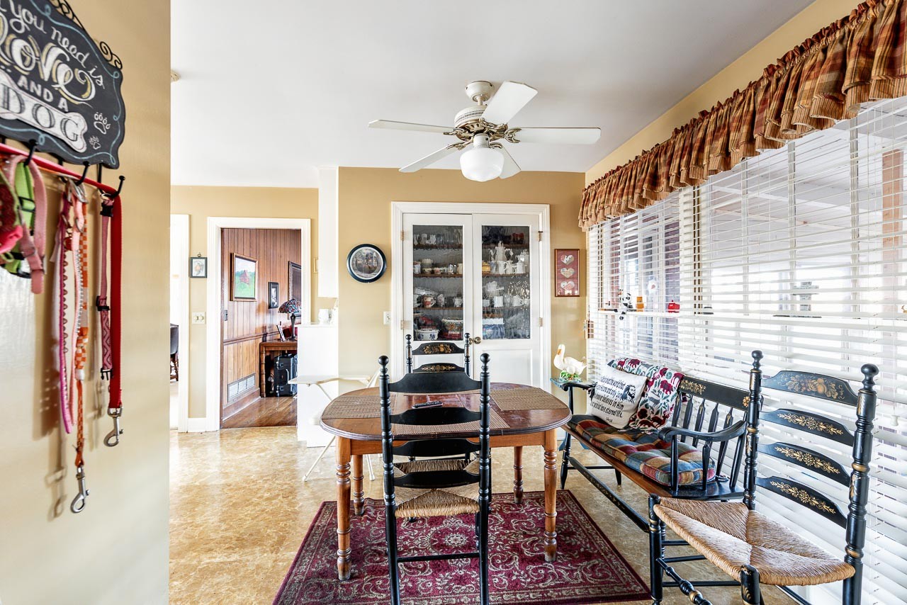4832 Murfreesboro Road Arrington, TN 37014 - Photo 11 of 70 a living room with furniture a chandelier and a dining table