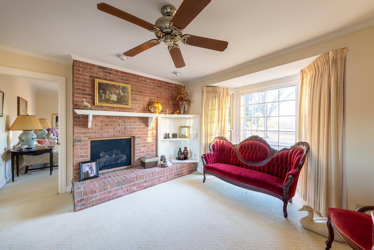 4832 Murfreesboro Road Arrington, TN 37014 - Photo 14 of 70 a living room with furniture and a fireplace